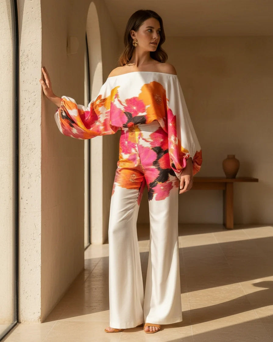 Model wearing an abstract print one-shoulder top with matching wide-leg trousers. - 4