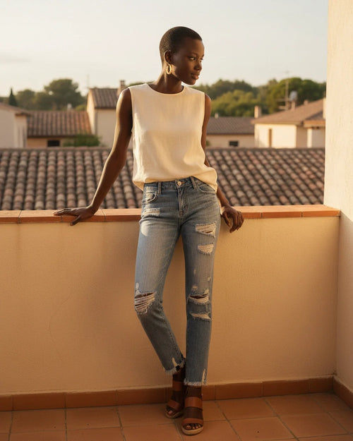 Light blue high-waist skinny denim jeans with distressed knee rips and frayed hems. - 2