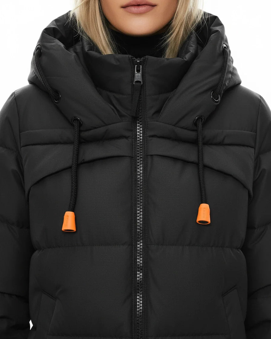 A black long-sleeve midi puffer coat featuring horizontal quilting, a large drawstring hood with orange accents, and a front zipper. - 6