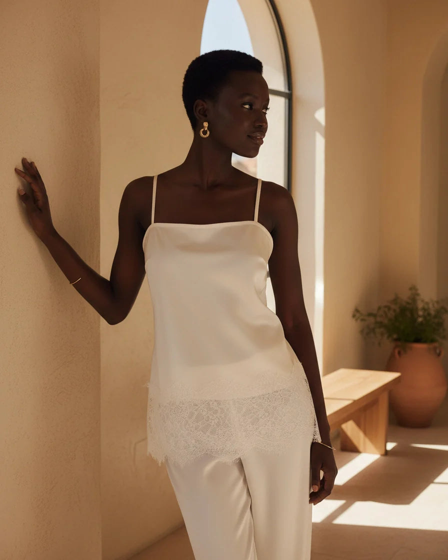 Cream satin camisole with spaghetti straps and eyelash lace trim hem. - 2