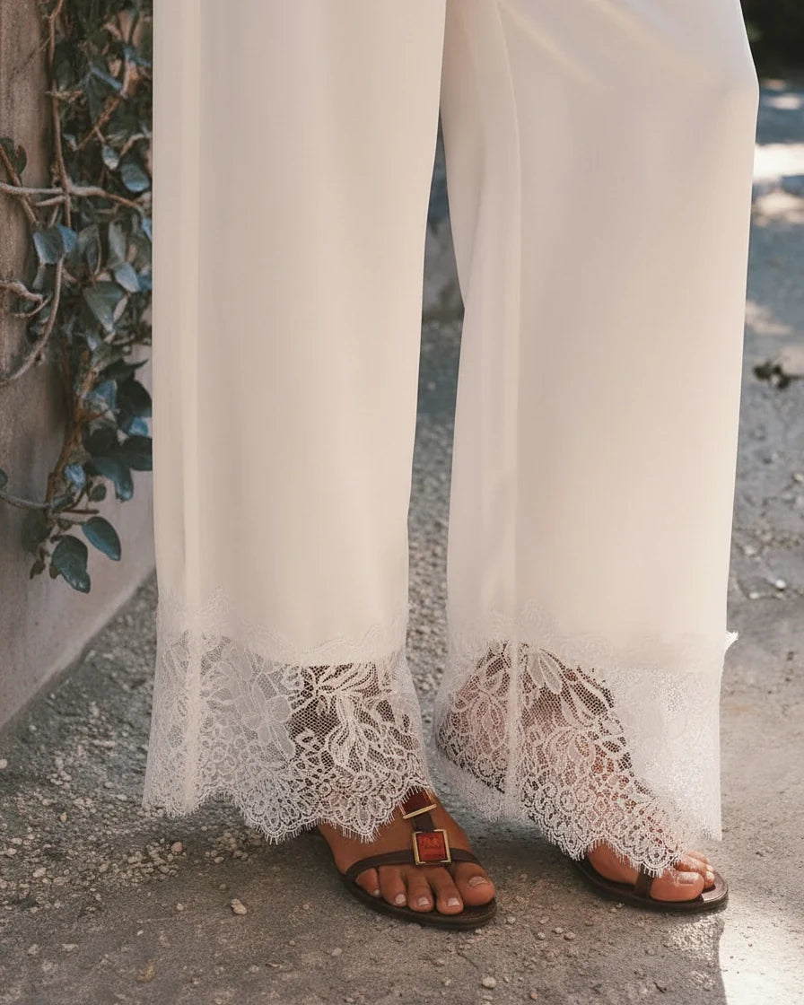 Wide-leg cream satin pants featuring a scalloped lace hem and relaxed fit. - 4