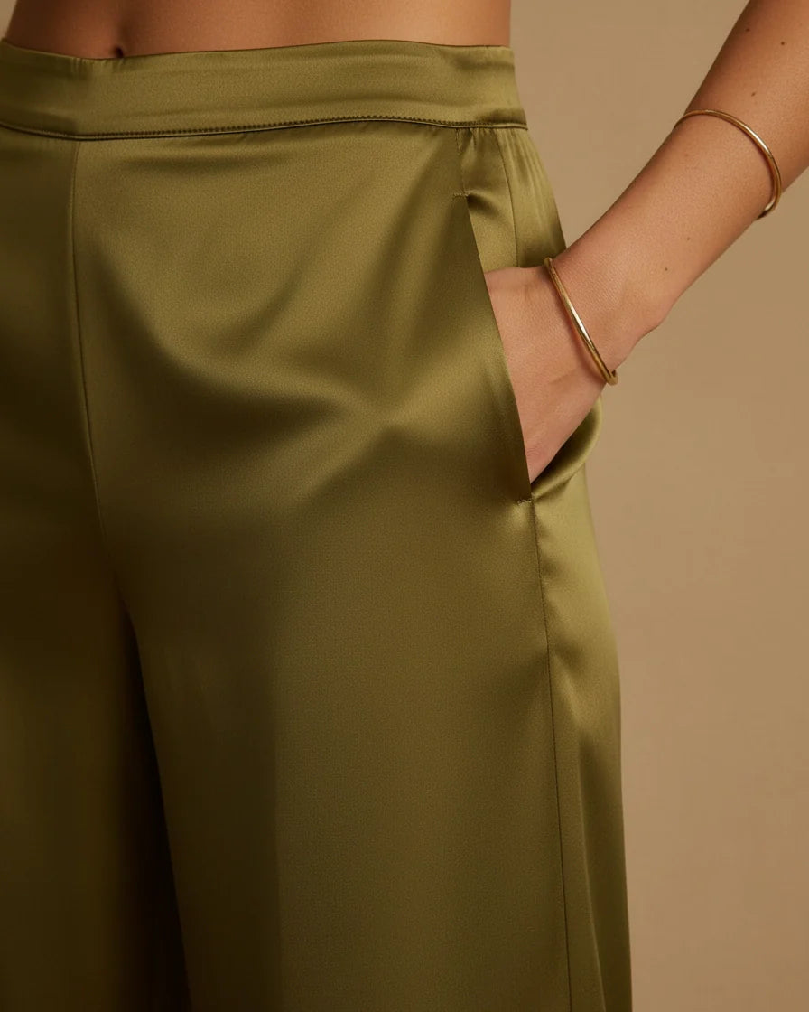 High-waisted olive green satin trousers with a straight-leg silhouette and lustrous finish. - 4