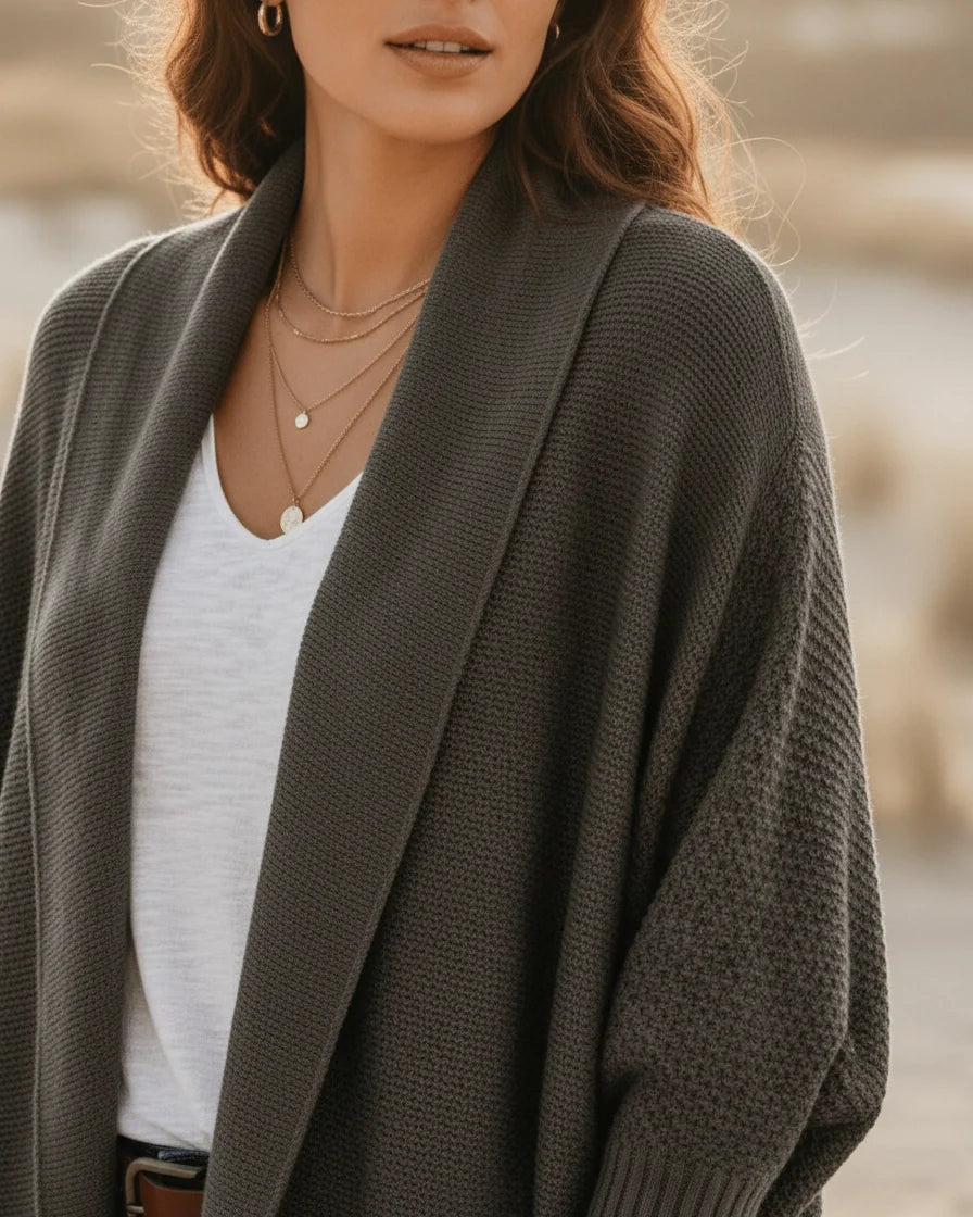 Oversized knit cardigan in army green featuring dramatic batwing sleeves and long ribbed cuffs. - 6