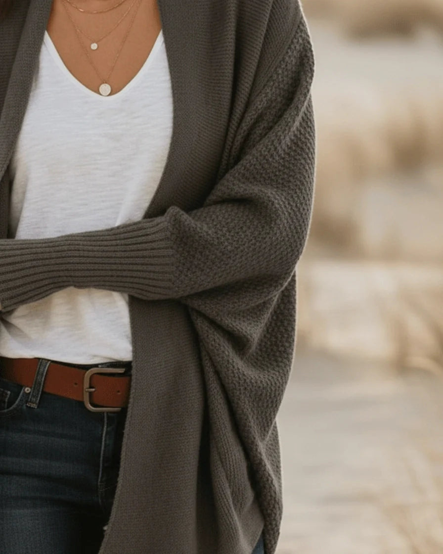 Oversized knit cardigan in army green featuring dramatic batwing sleeves and long ribbed cuffs. - 7