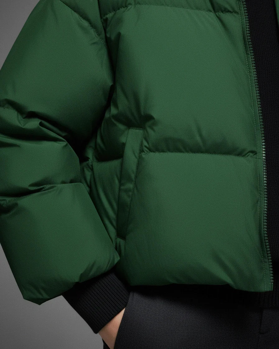 Oversized green puffer jacket with horizontal quilting, stand collar, and ribbed cuffs. - 8