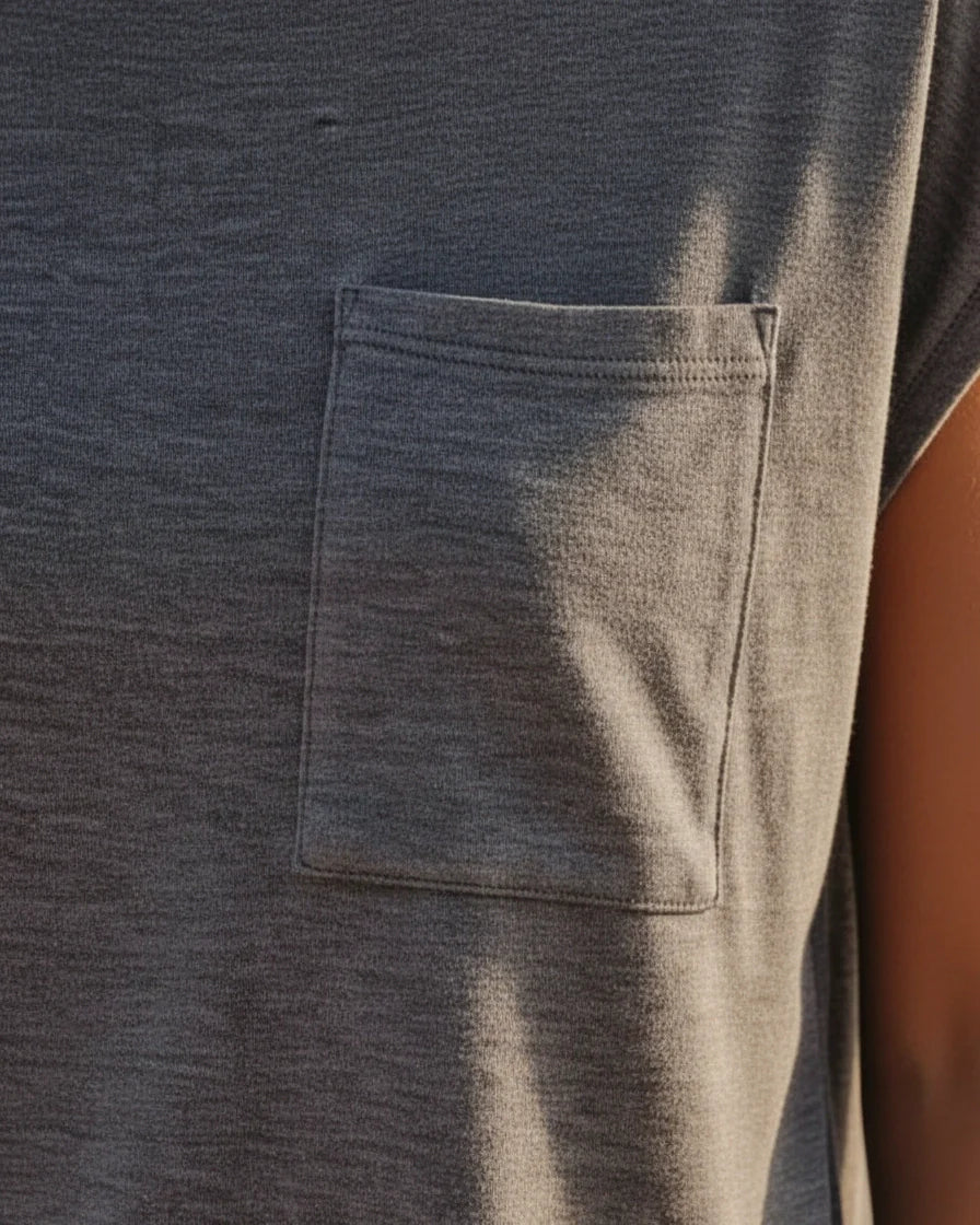 A woman wearing a relaxed-fit short sleeve crew neck t-shirt with a chest patch pocket. - 7