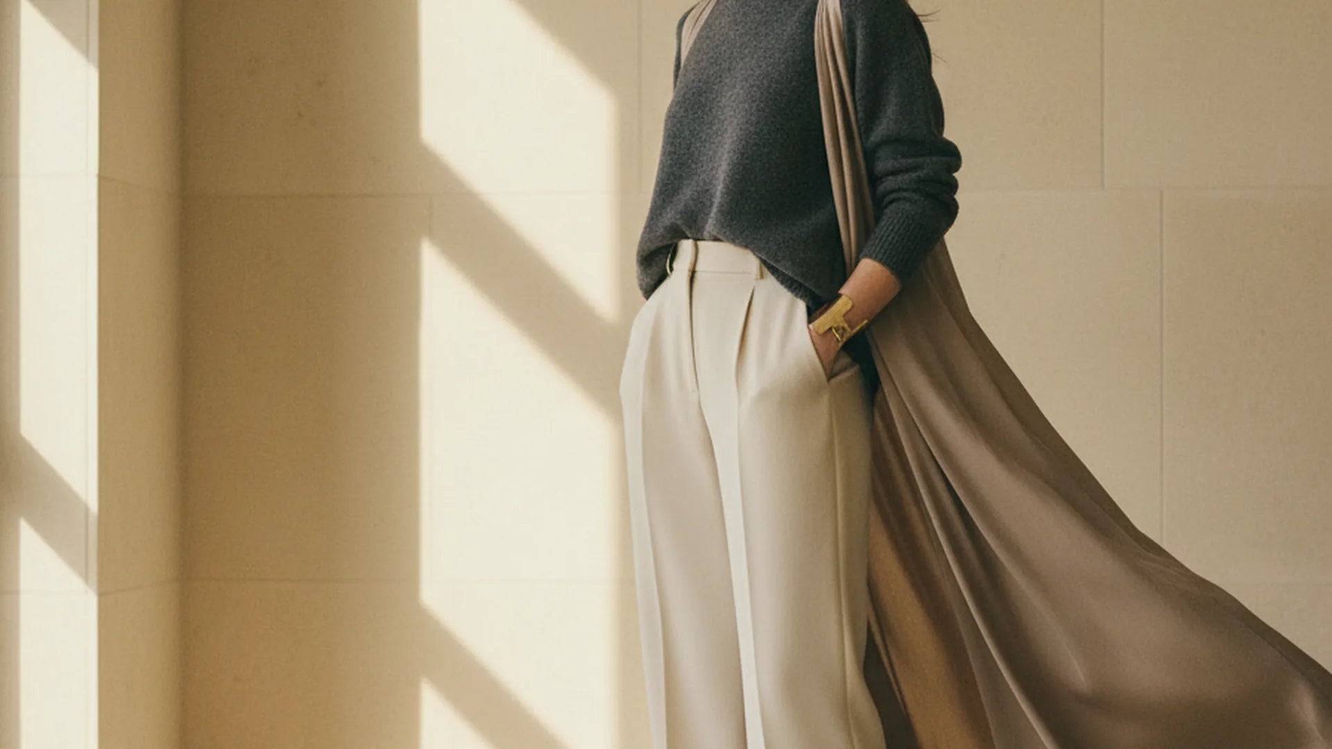 Polarys editorial campaign scene with contemporary women's fashion silhouettes in a calm architectural setting