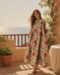 Woman wearing a long-sleeve floral print denim-look dress with a soft collar and side pockets - Multicolor