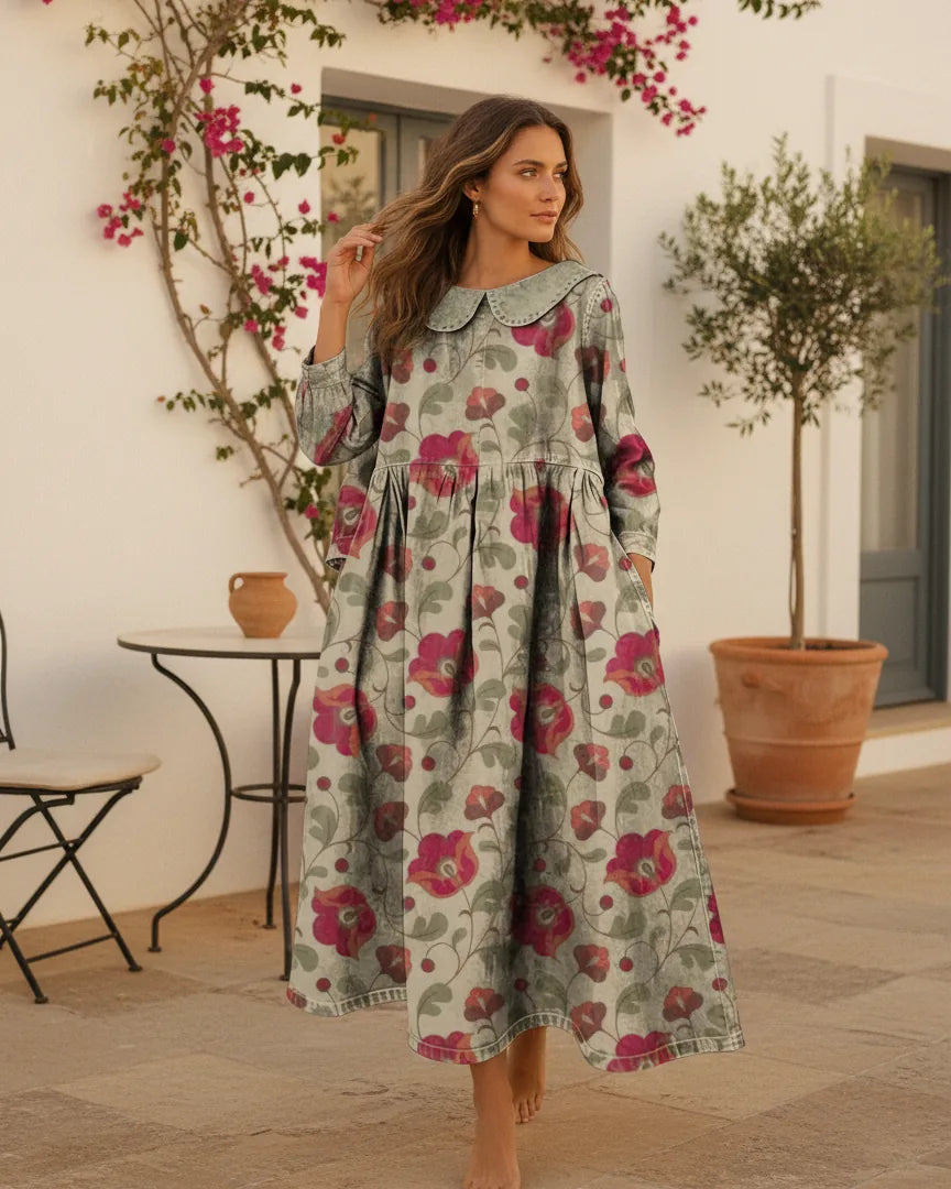 Woman wearing a long-sleeve floral print denim-look dress with a soft collar and side pockets