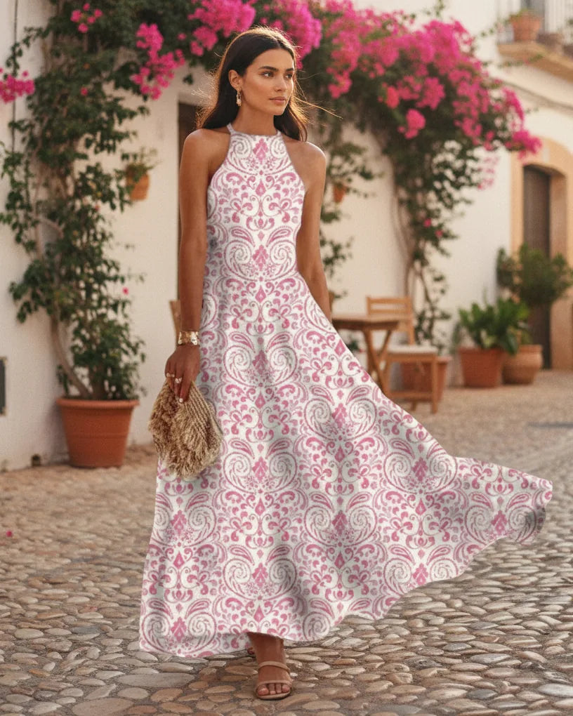 Woman wearing a printed halter-neck maxi dress with an easy A-line drape - Green