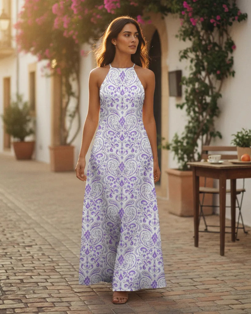 Woman wearing a printed halter-neck maxi dress with an easy A-line drape