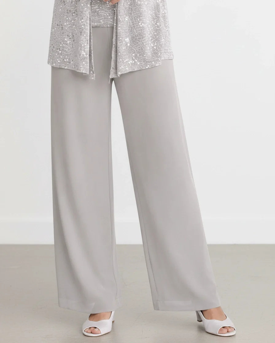A three-piece silver evening set featuring a sequined lace open jacket, matching square-neck top, and flowing wide-leg trousers. - 7