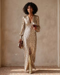 Full-length relaxed maxi dress with a shimmering finish, V-neckline, and long bishop sleeves.